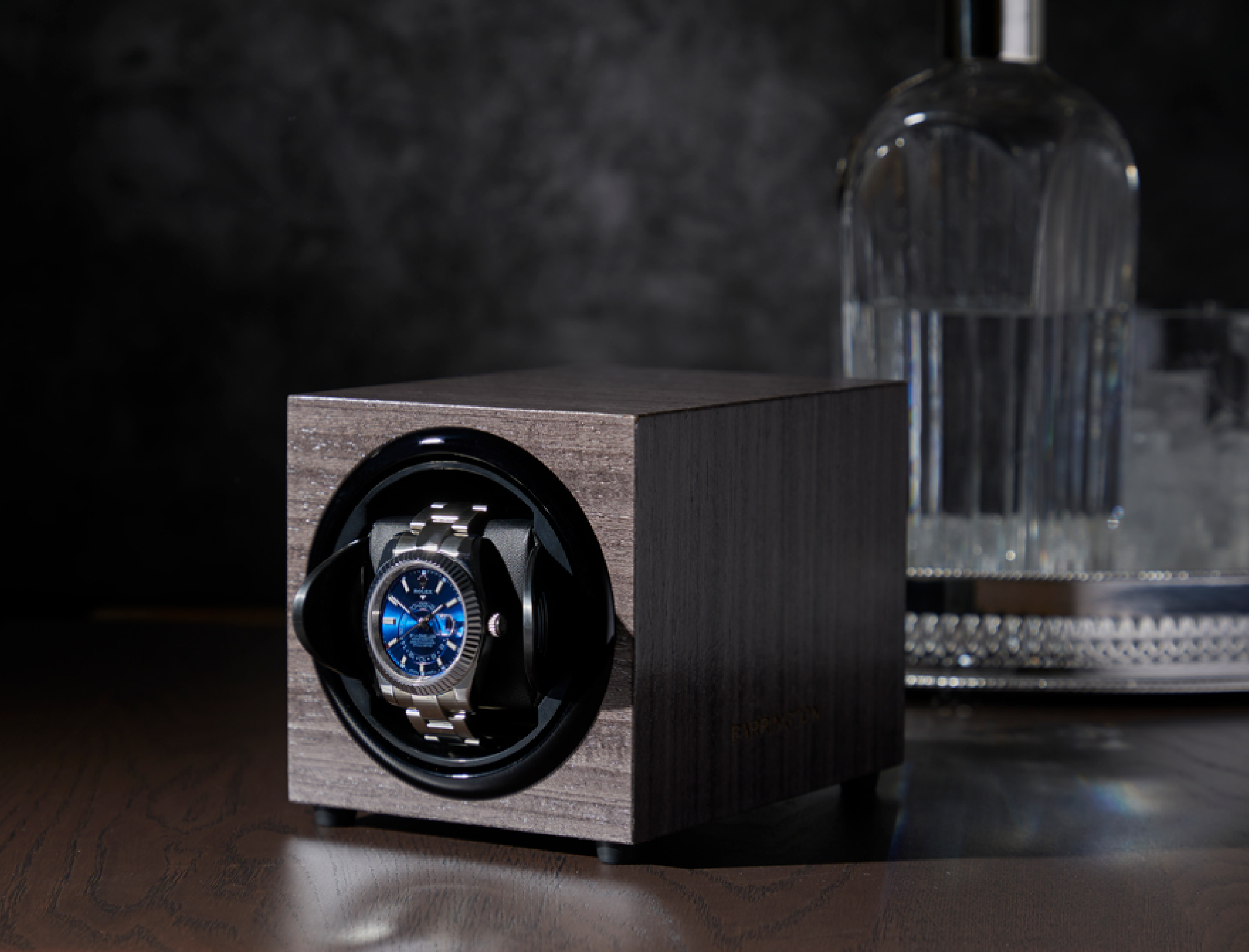 Wooden watch winder on table