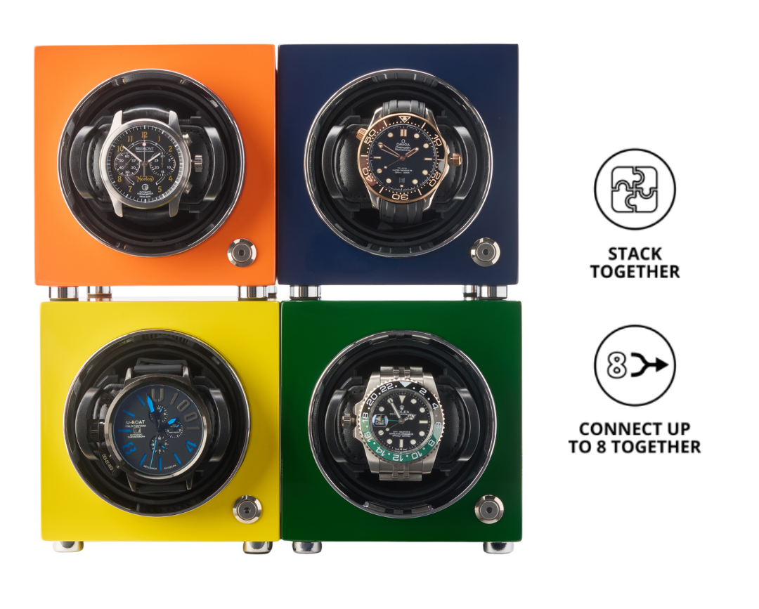 Four colorful watch winders stacked together on a white background