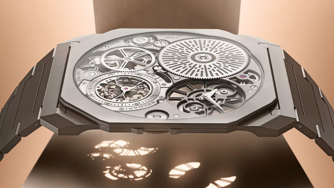 Close-up of a luxury watch with intricate mechanical design on a beige background